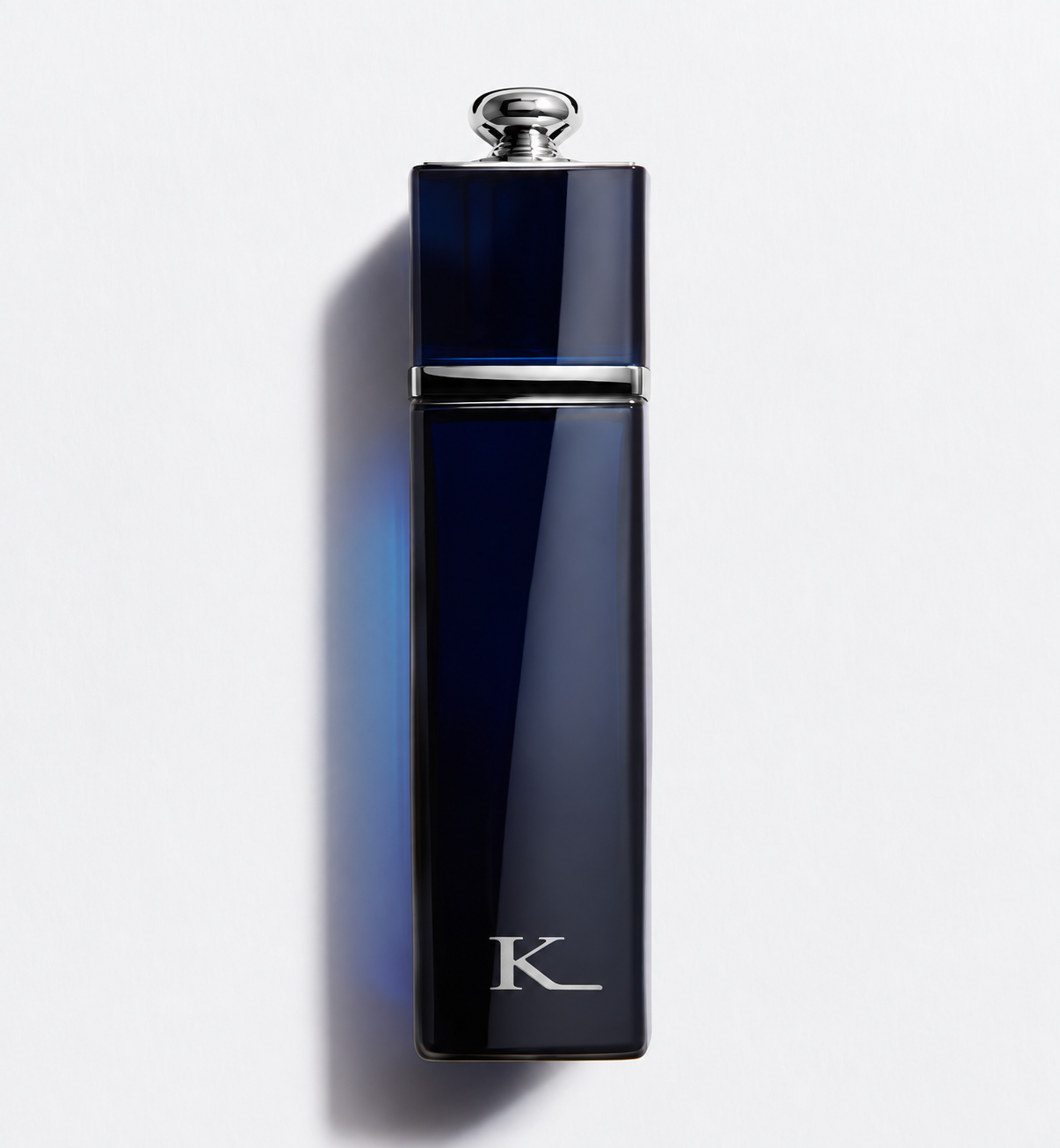 Kissing Light Deep blue fragrance bottle with silver K monogram